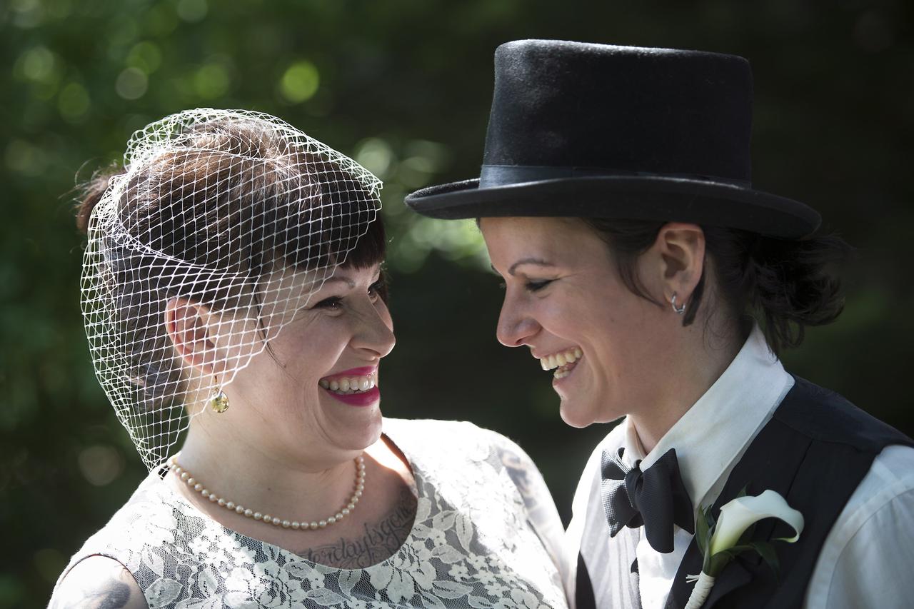 Michelle Brand, May BrandMichelle, left, and May Brand laugh before joining over 100 gay couples in a mass wedding during World Pride 2014 at Casa Loma in Toronto, on Thursday, June 26, 2014. THE CANADIAN PRESS/Darren CalabreseDarren Calabrese Photo: Pres
