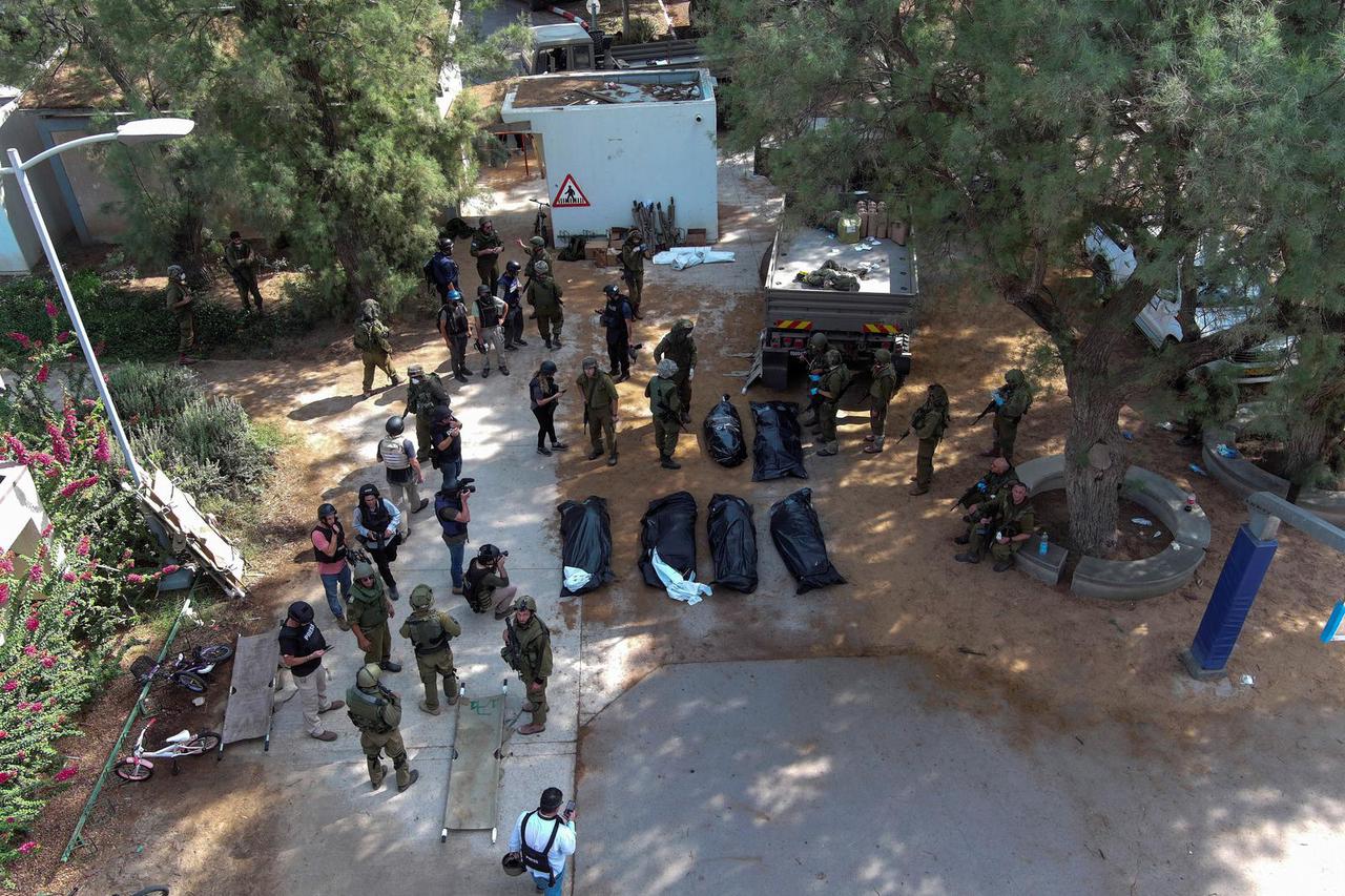 Israeli soldiers ride in a military vehicle near Israel's border with Gaza, in southern Israel