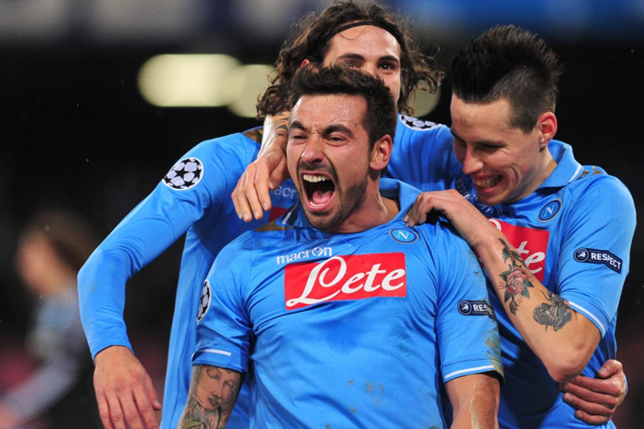 'Napoli\'s Argentine forward Ezequiel Ivan Lavezzi (L) celebrates vwith  Napoli\'s Uruguayan forward Edinson Roberto Cavani (back) after scoring during the Champions League round of 16 first leg footb