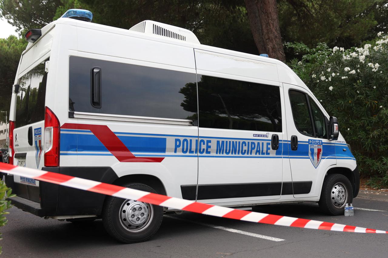 French police car is seen after cars were set on fire in front of the city's synagogue, in La Grande-Motte