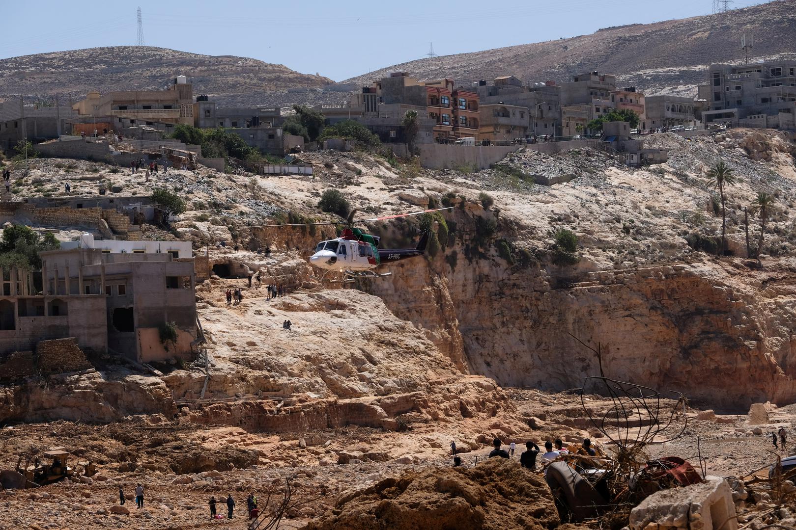 A helicopter flies over a damaged area, after a powerful storm and heavy rainfall hit Libya, in Derna, Libya September 13, 2023. REUTERS/Esam Omran Al-Fetori Photo: ESAM OMRAN AL-FETORI/REUTERS