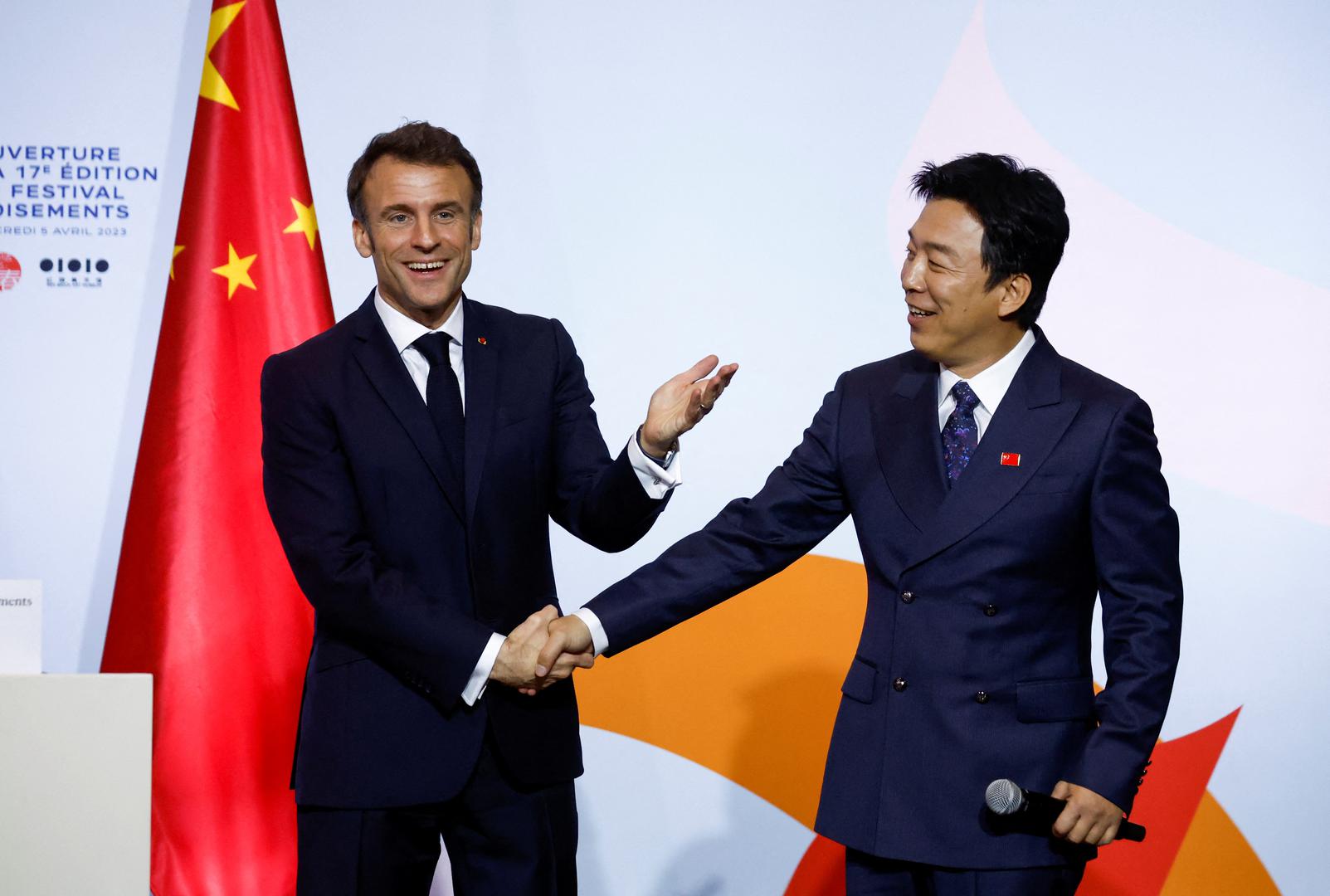 French President Emmanuel Macron shakes hands with Chinese actor Huang Bo following a speech to inaugurate the Festival Croisements at the Red Brick Museum in Beijing, China, April 5, 2023. REUTERS/Gonzalo Fuentes Photo: GONZALO FUENTES/REUTERS