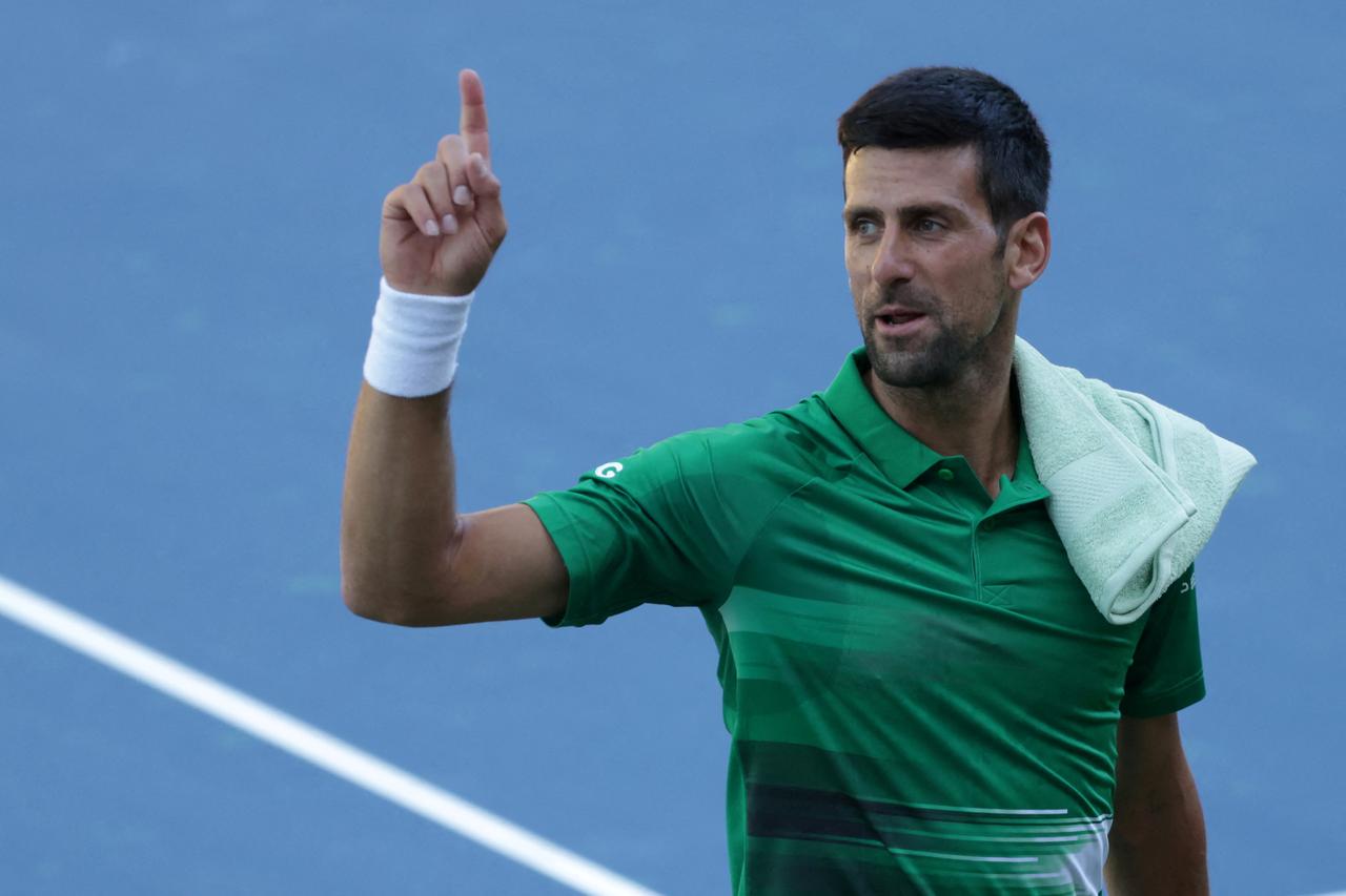 FILE PHOTO: Serbian tennis player Novak Djokovic performs during the opening of a regional tennis centre that will prepare top tennis players for major tournaments, in Visoko