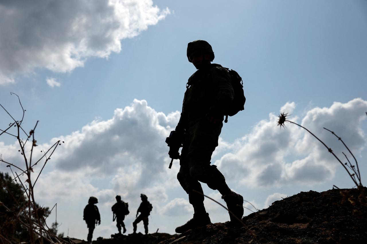 Israeli soldiers gather after the alert of an apparent security incident, in Ashkelon, southern Israel