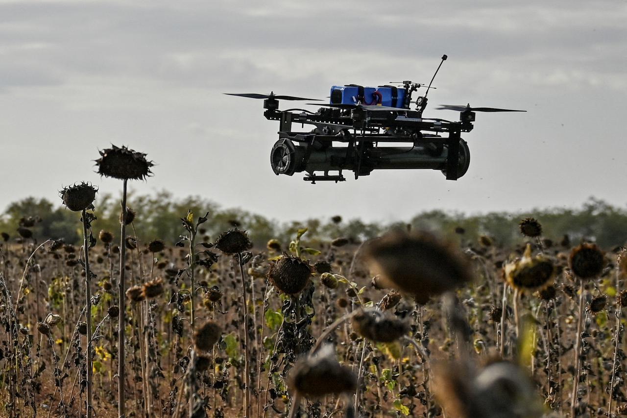 FPV drone with an attached portable grenade launcher is seen during a test fly conducted by Ukrainian servicemen at their position near a frontline, amid Russia's attack on Ukraine in the Zaporizhzhia region