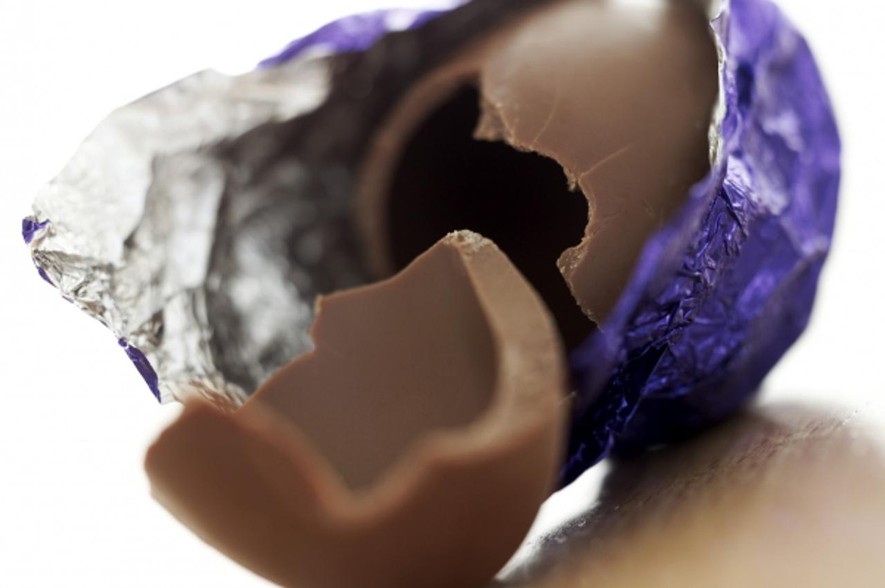 'close-up of an open foil wrapped chocolate candy; broken'