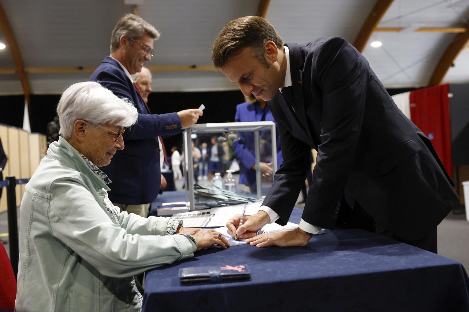 French President Emmanuel Macron (R) votes in the second round of French parliamentary elections at polling station in Le Touquet-Paris-Plage, northern France, France, 07 July 2024.MOHAMMED BADRA/Pool via REUTERS Photo: MOHAMMED BADRA / POOL/REUTERS