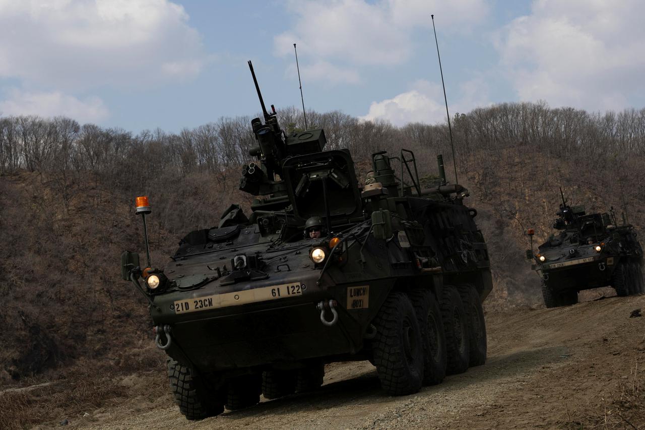 South Korean and US soldiers conduct a joint river-crossing  exercise in Yeoncheon