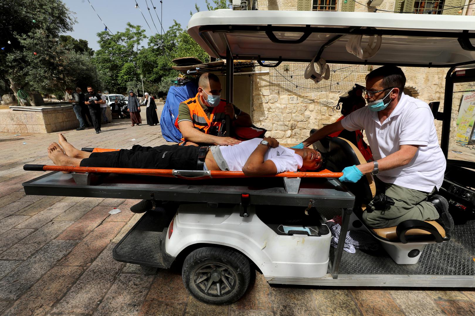 Israeli police clash with Palestinians at the compound that houses Al-Aqsa Mosque in Jerusalem A wounded Palestinian is evacuated during clashes with Israeli police at the compound that houses Al-Aqsa Mosque, known to Muslims as Noble Sanctuary and to Jews as Temple Mount, in Jerusalem's Old City, May 10, 2021. REUTERS/Ammar Awad AMMAR AWAD