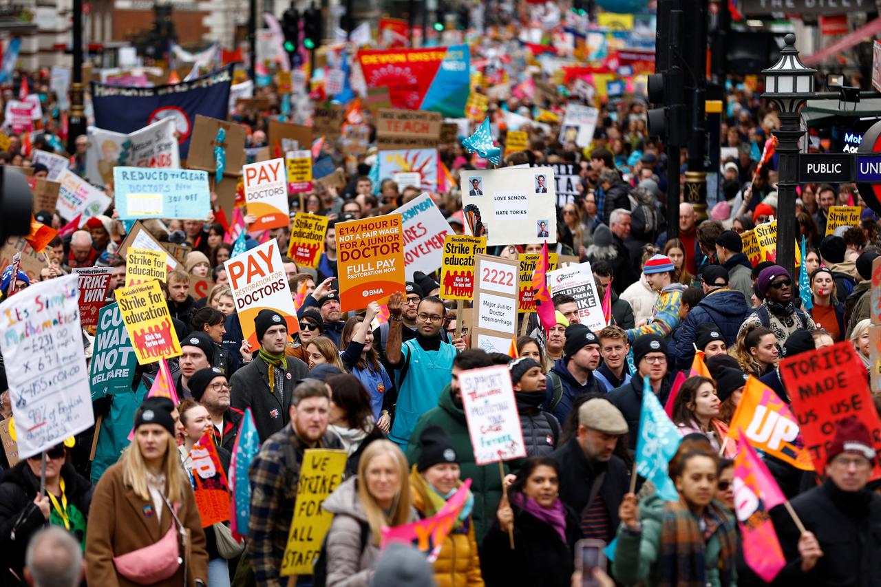 Teachers attend a march during strike action in a dispute over pay, in London