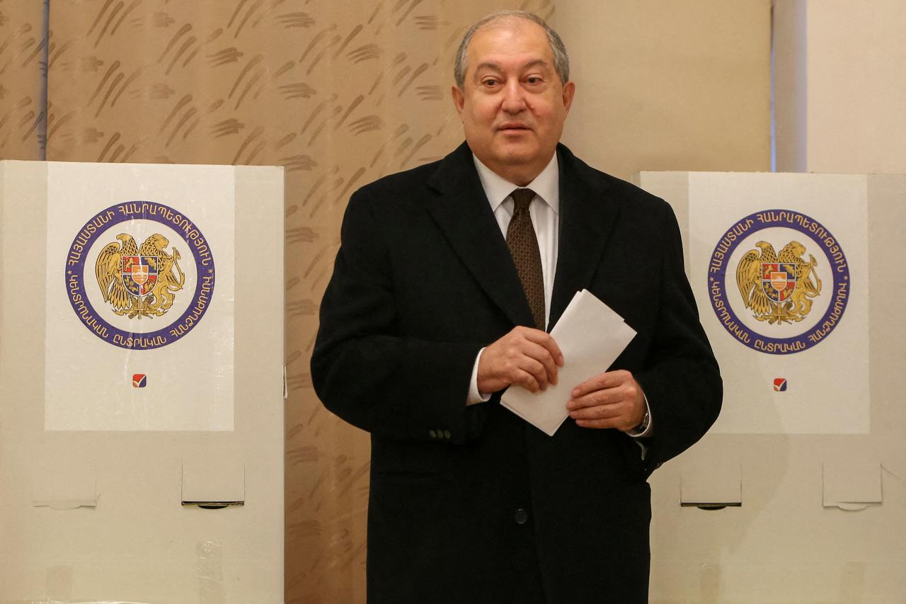 FILE PHOTO: Armenian President Armen Sarkissian votes during an early parliamentary election in Yerevan, Armenia