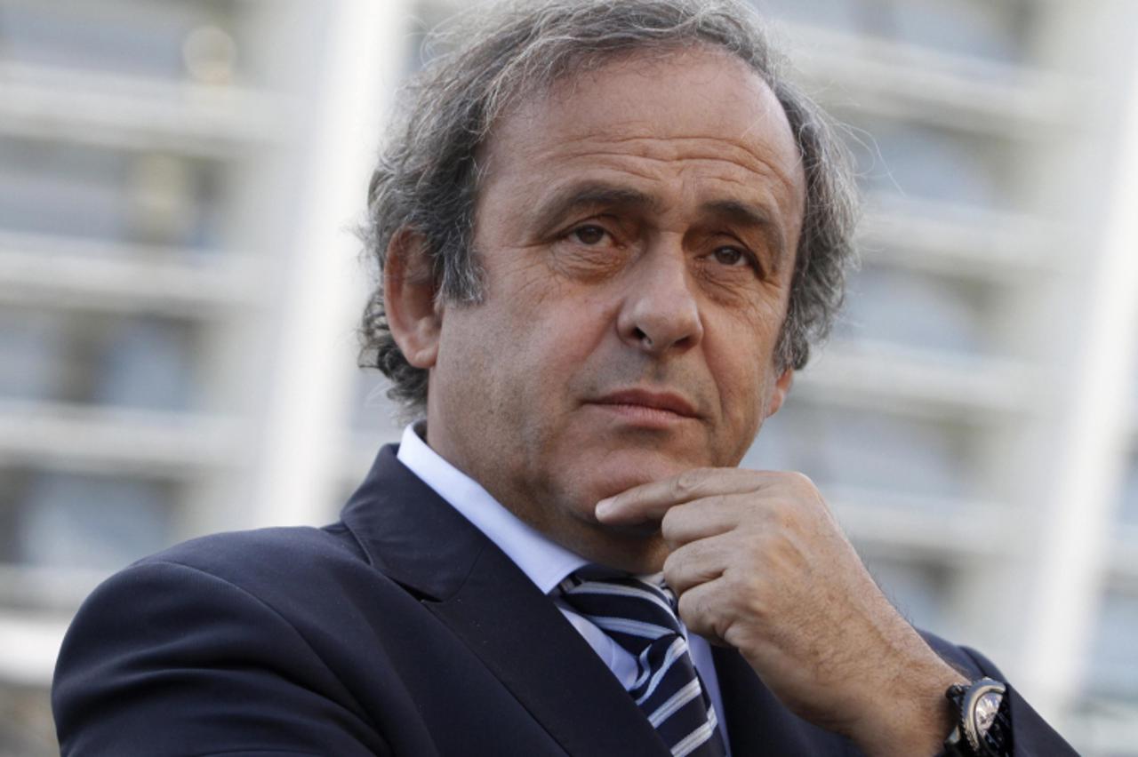 'UEFA President Michel Platini are seen in front of a stadium in Kiev, September 27, 2011. The stadium is one of the venues for the Euro 2012 soccer tournament, to be hosted by Poland and Ukraine next