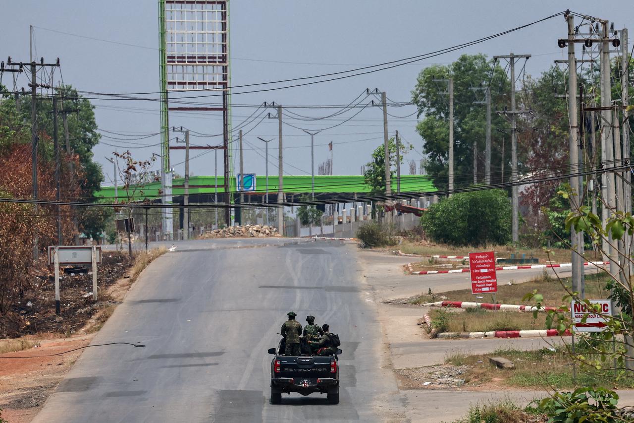 FILE PHOTO: Soldiers from the rebel Karen National Liberation Army patrol in the Myanmar border town of Myawaddy