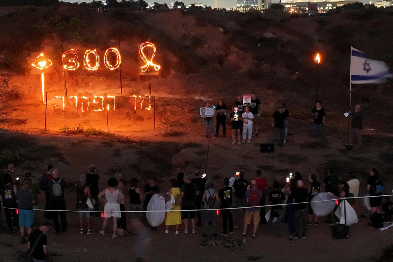 Supporters of the hostages being held in Gaza mark 300 days since the deadly October 7 attack, in Tel Aviv