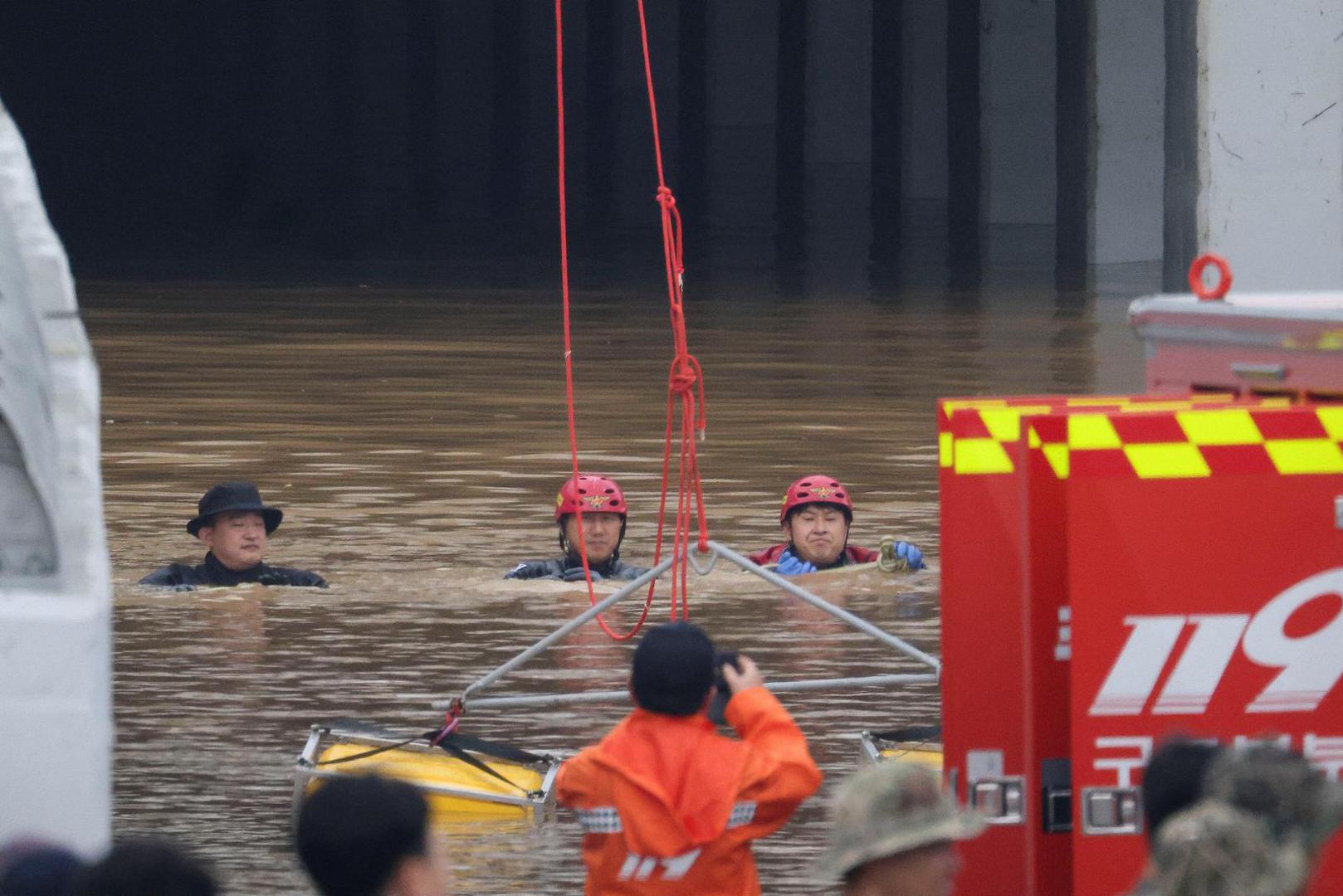 Rescue workers take part in a search and rescue operation near an underpass that has been submerged by an flooded river caused by torrential rain in Cheongju, South Korea, July 16, 2023.   REUTERS/Kim Hong-ji Photo: KIM HONG-JI/REUTERS