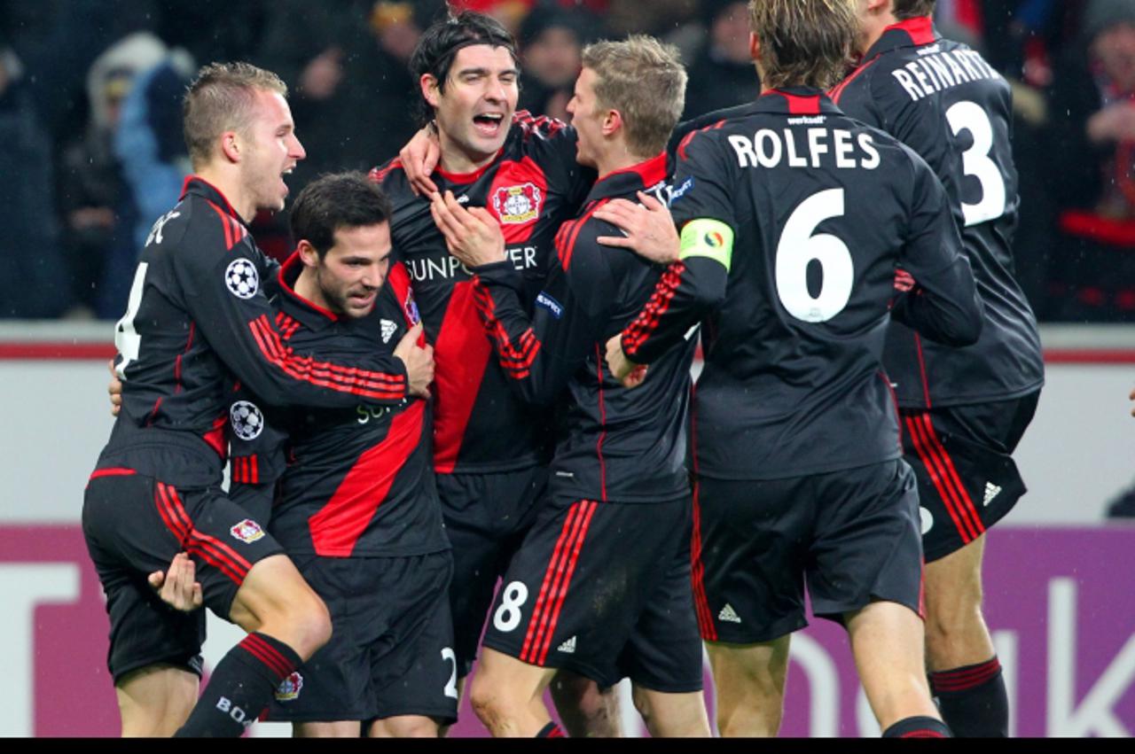 \'Michal Kadlec (L) of Leverkusen celebrates with the team after scoring the 1-1 during the Champions League round of sixteen first leg soccer match between Bayer Leverkusen and FC Barcelona at the Ba