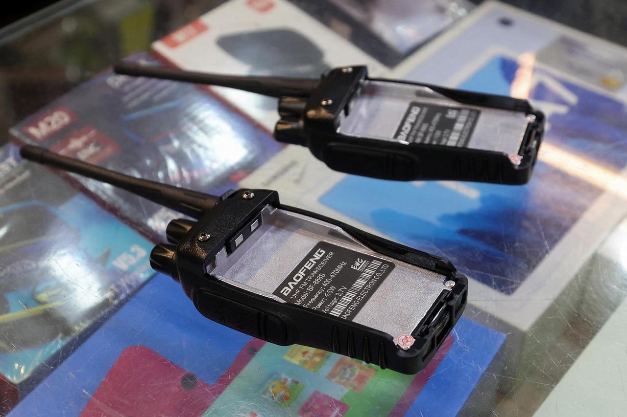 Walkie-talkie devices without batteries are shown at an electronic store, in Sidon