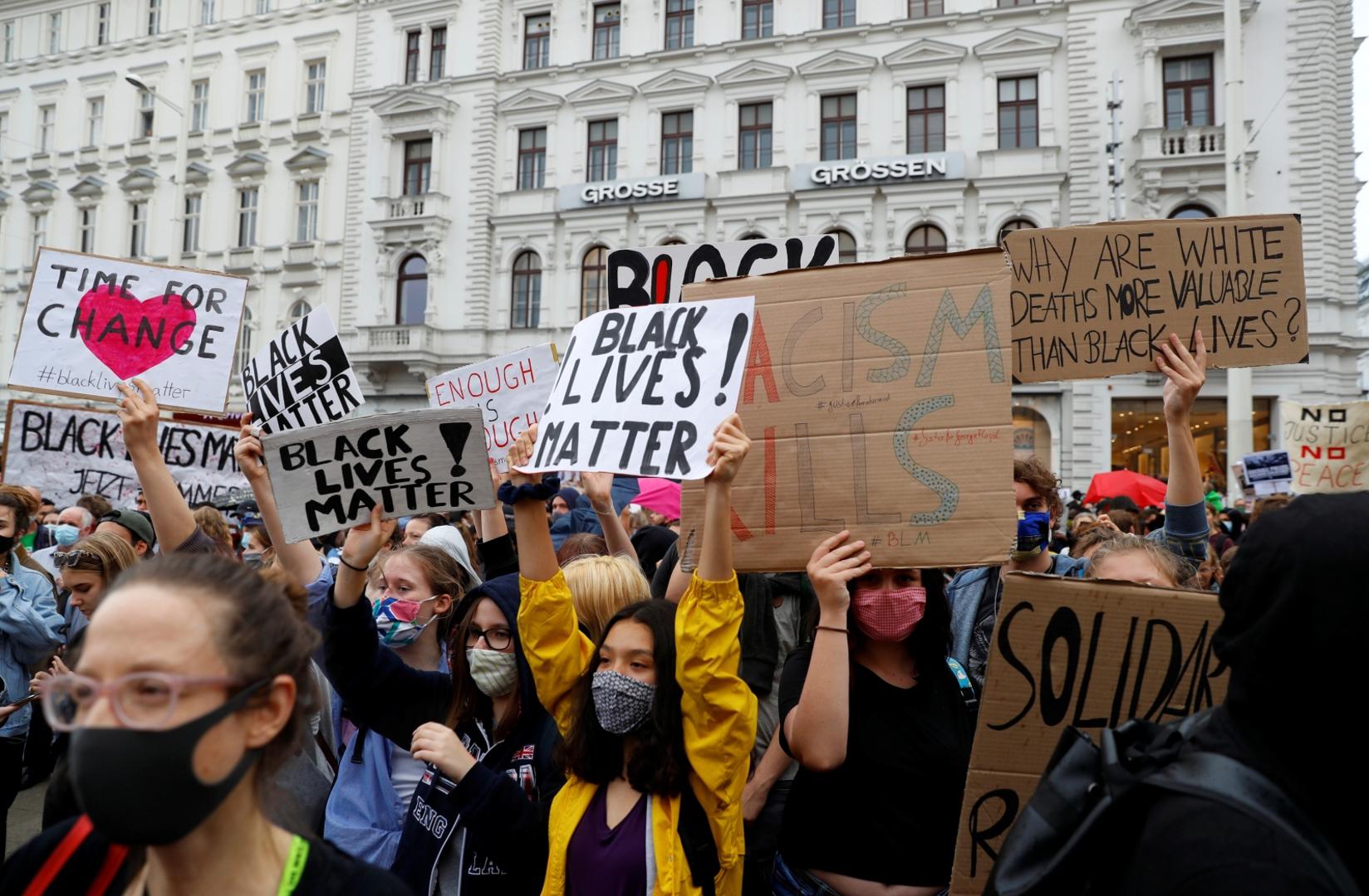 Protest against the death in Minneapolis police custody of George Floyd, in Vienna People hold signs which read "Black Lives Matter" during a protest against the death in Minneapolis police custody of George Floyd, in Vienna, Austria June 4, 2020. REUTERS/Leonhard Foeger LEONHARD FOEGER