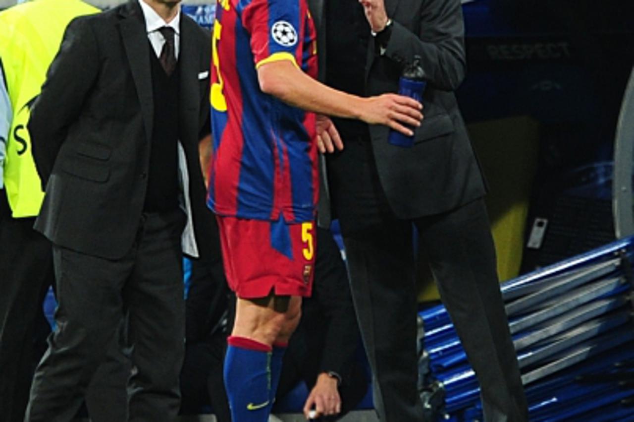 'Real Madrid Coach Jose Mourinho (right) has words with Barcelona\'s Carles Puyol (left) on the touchline Photo: Press Association/Pixsell'