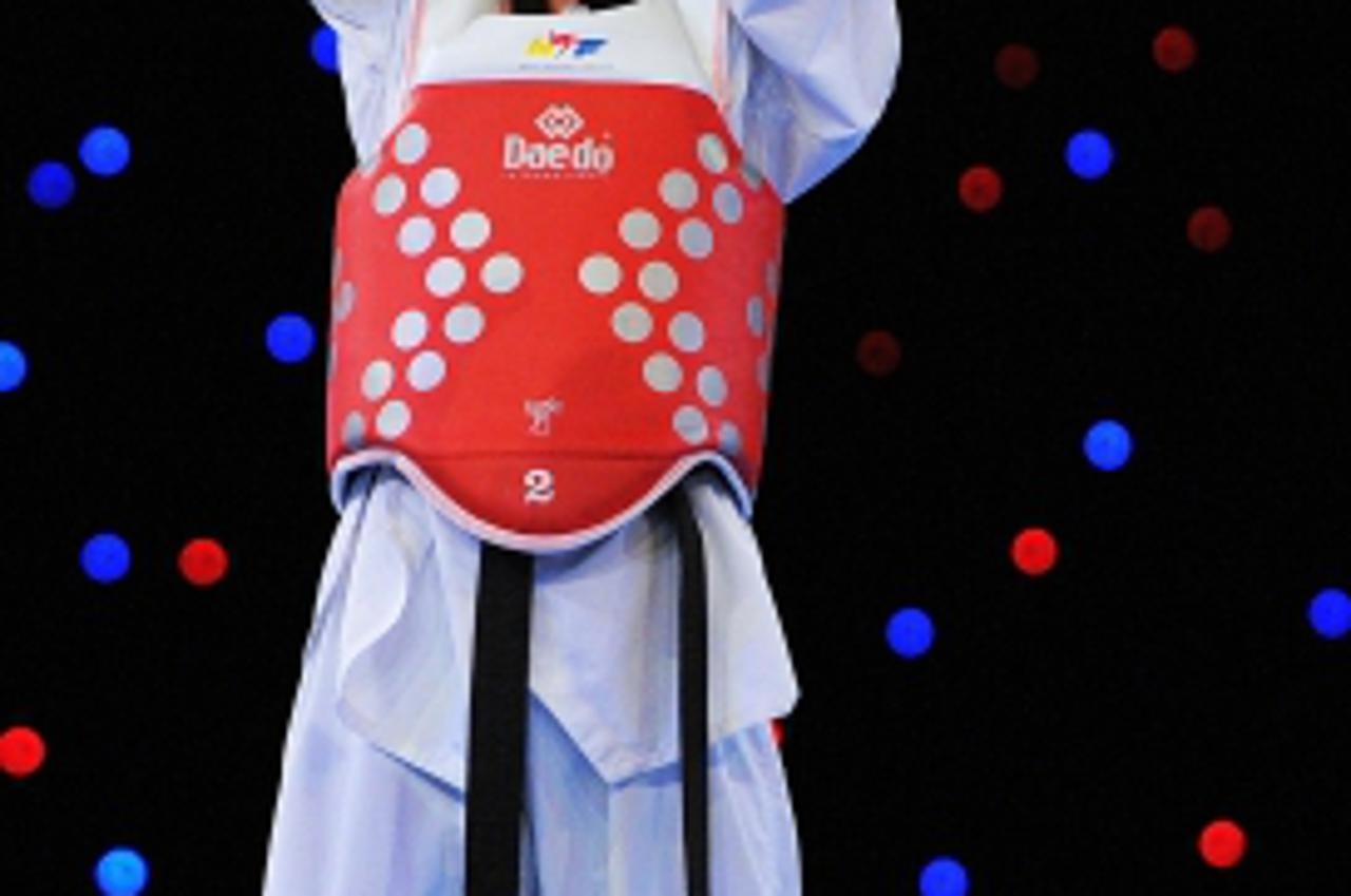 'Croatia\'s Lucija Zaninovic celebrates her victory over Russia\'s Kristina Kim during the women\'s -49kg final during day two of the 2012 European Taekwondo Championships at Sportcity in Manchester, 