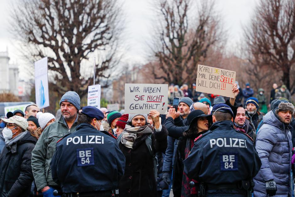 People attend a protest after swearing-in of a new government, in Vienna