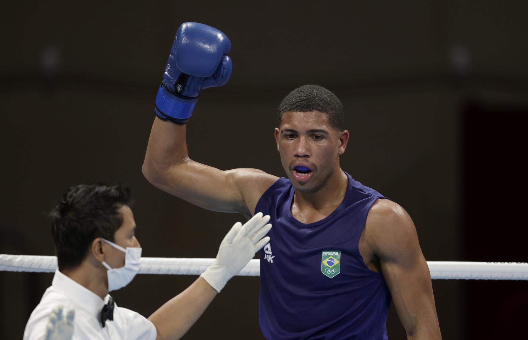 Boxing - Men's Middleweight - Final Tokyo 2020 Olympics - Boxing - Men's Middleweight - Final - Kokugikan Arena - Tokyo, Japan - August 7, 2021. Hebert Sousa of Brazil reacts after knocking down Oleksandr Khyzhniak of Ukraine during their final fight. REUTERS/Ueslei Marcelino UESLEI MARCELINO