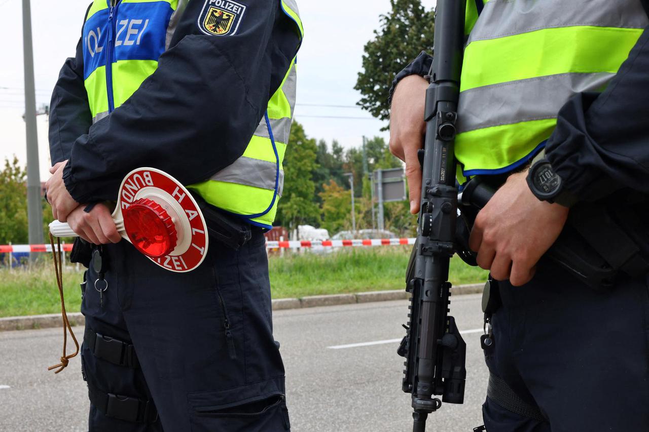 German police officers conduct random checks at a border with France, in Kehl