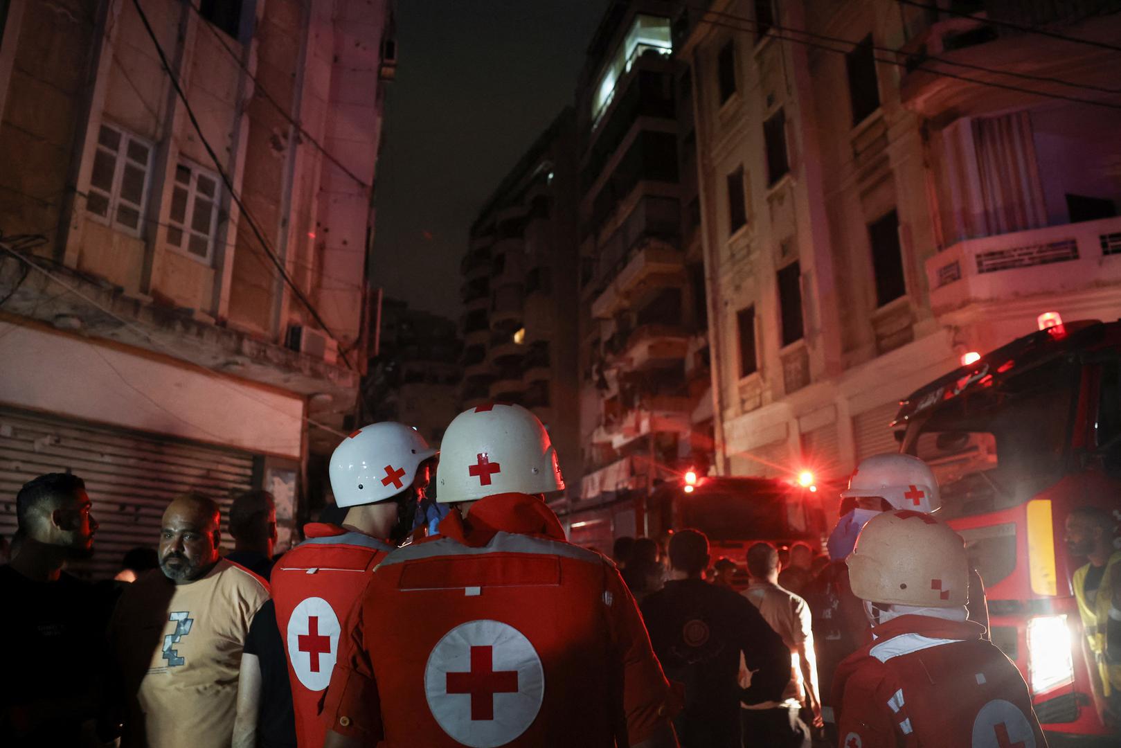 Members of the Red Cross stand near a damaged building at the site of an Israeli air strike, amid ongoing hostilities between Hezbollah and Israeli forces, in Beirut, Lebanon, October 10, 2024. REUTERS/Louisa Gouliamaki Photo: LOUISA GOULIAMAKI/REUTERS