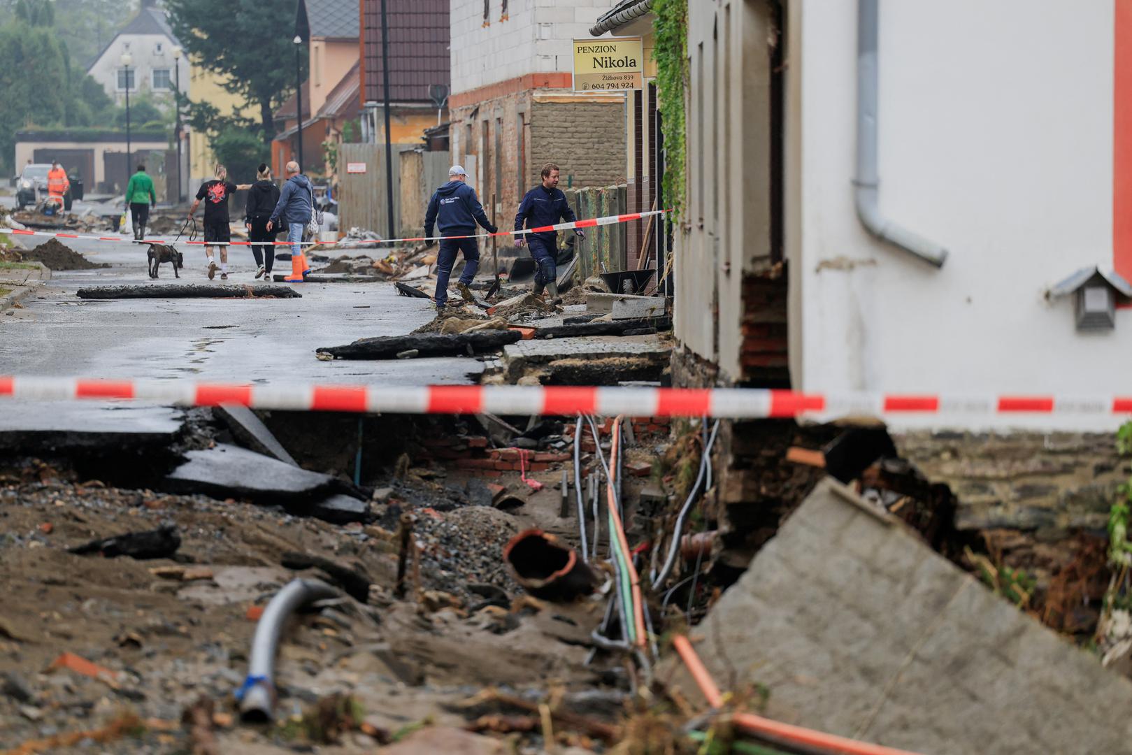 A view of the damage as people walk near the debris in the aftermath of flooding following heavy rainfalls, in Jesenik, Czech Republic, September 16, 2024. REUTERS/David W Cerny Photo: DAVID W CERNY/REUTERS