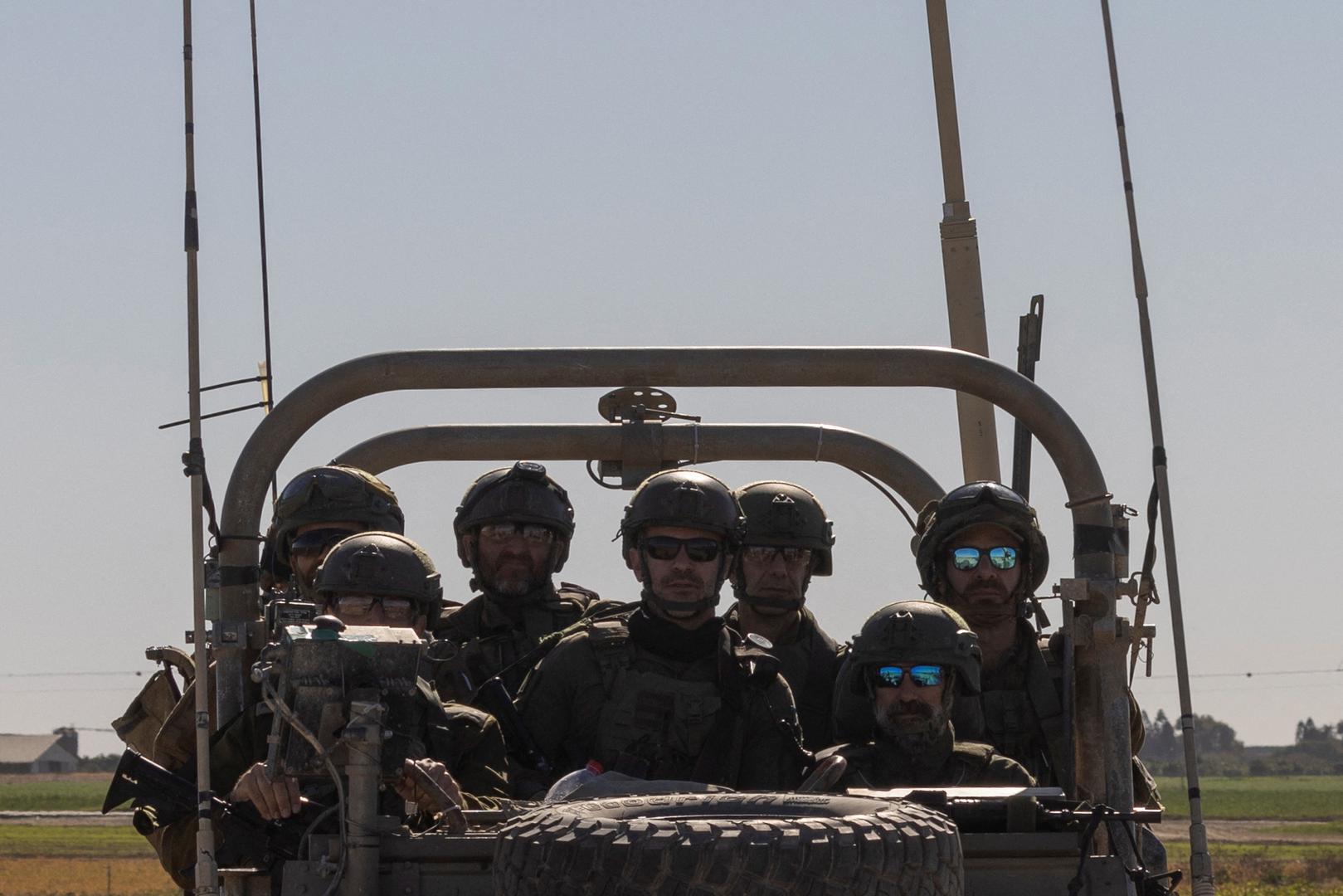 Israeli soldiers ride a military vehicle as they drive towards Gaza, amid the ongoing conflict between Israel and the Palestinian Islamist group Hamas, as seen from southern Israel, January 13, 2024. REUTERS/Tyrone Siu Photo: TYRONE SIU/REUTERS