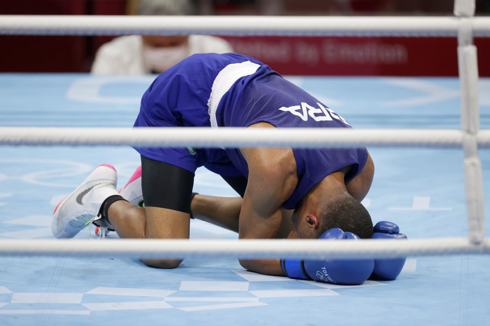 Boxing - Men's Middleweight - Final Tokyo 2020 Olympics - Boxing - Men's Middleweight - Final - Kokugikan Arena - Tokyo, Japan - August 7, 2021. Hebert Sousa of Brazil reacts after knocking down Oleksandr Khyzhniak of Ukraine during their final fight. REUTERS/Ueslei Marcelino UESLEI MARCELINO