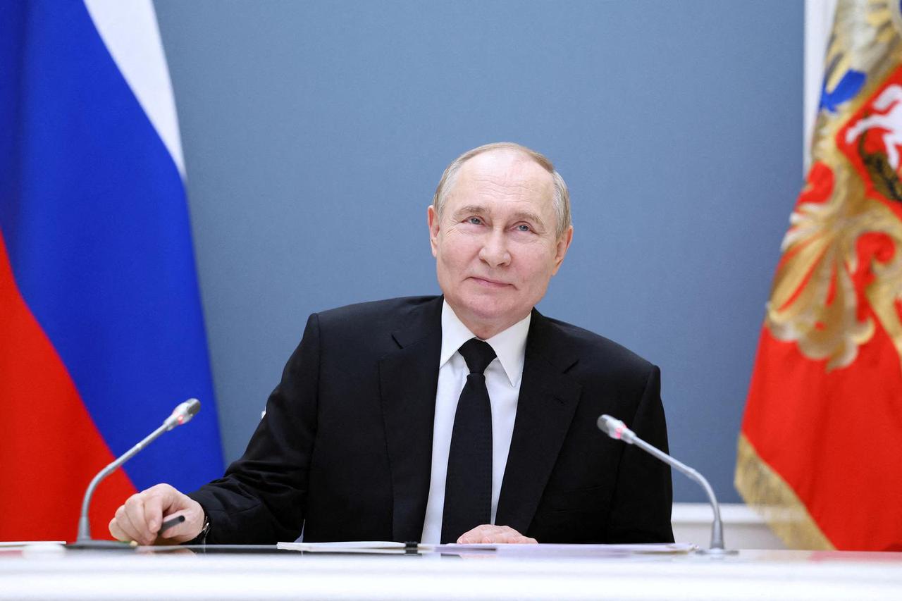 FILE PHOTO: Russian President Putin holds a meeting with large families from various Russia's regions via video link in Moscow