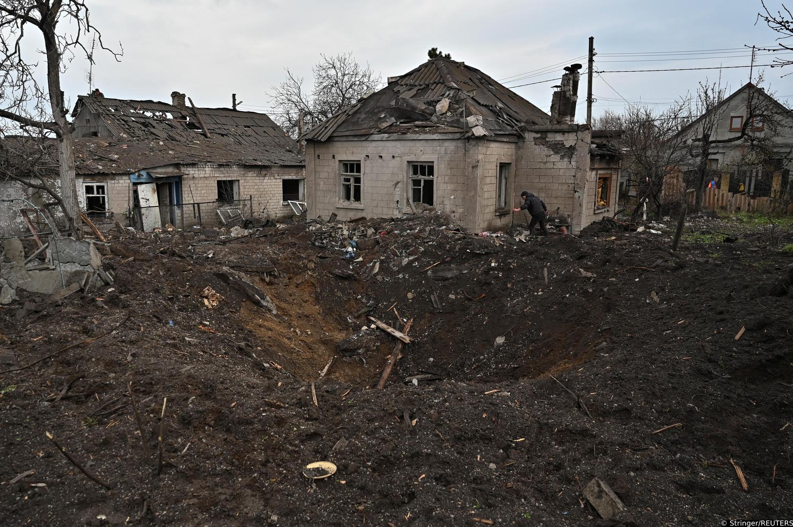 A local resident removes debris from his house damaged by a Russian missile strike, amid Russia's attack on Ukraine, in Zaporizhzhia, Ukraine April 9, 2023. REUTERS/Stringer Photo: Stringer/REUTERS