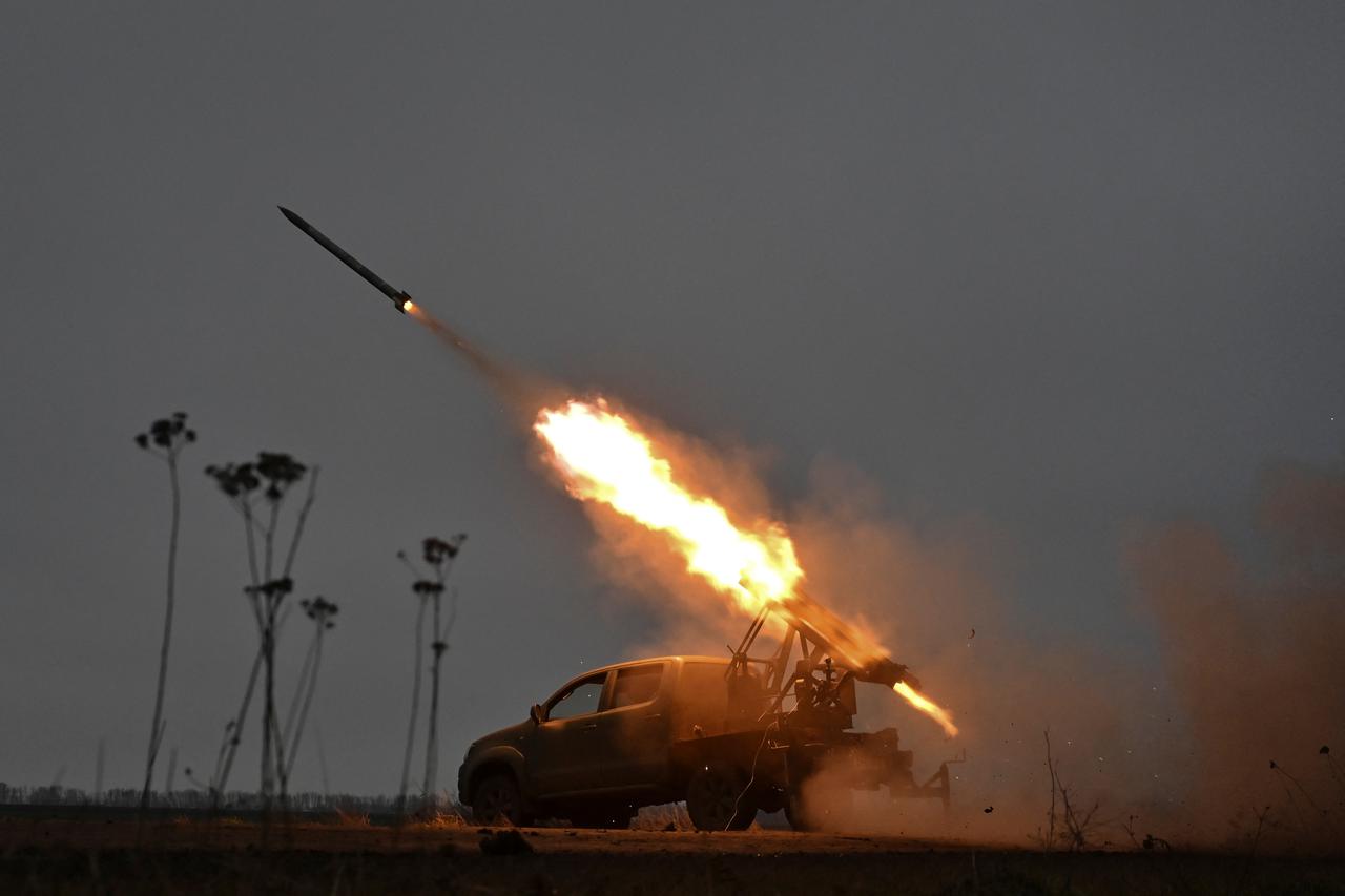 Police officers fire MLRS towards Russian troops in a front line in Zaporizhzhia region