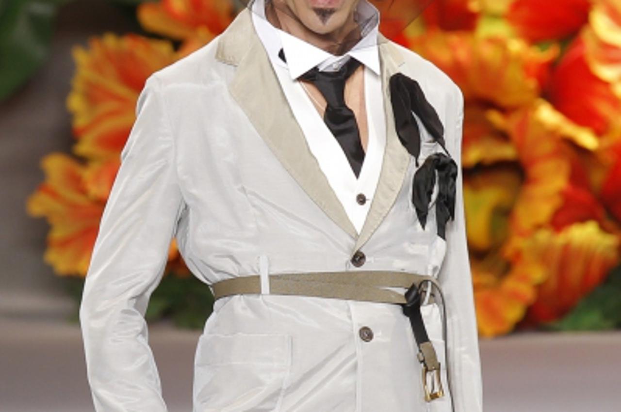 'British designer John Galliano appears at the end of his Fall/Winter 2010-2011 Haute Couture fashion show for French fashion house Dior in Paris in this July 5, 2010 file picture. Christian Dior has 