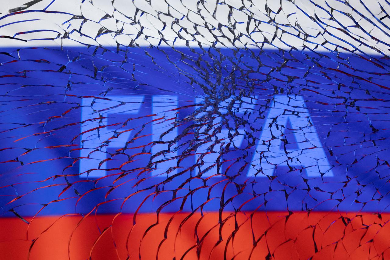 Illustration shows FIFA logo and Russian flag through broken glass