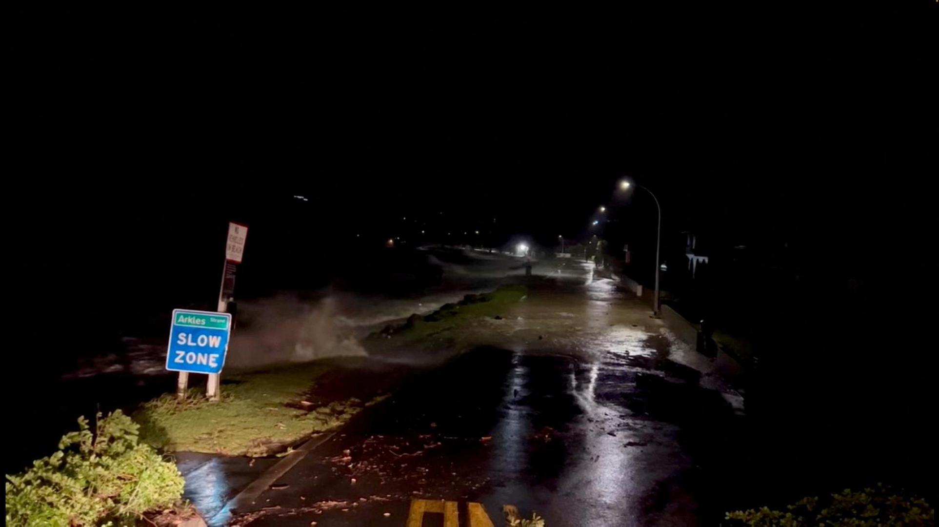 FILE PHOTO: A view shows high tides rising due to Cyclone Gabrielle in Arkles Bay, Auckland, New Zealand February 13, 2023 in this screen grab obtained from a social media video. John Longson/Twitter @JohnLongson/via REUTERS./File Photo Photo: John Longson/Twitter @JohnLongso/REUTERS