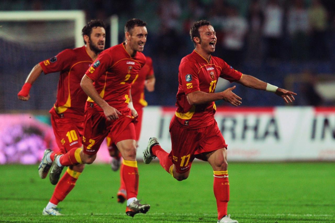 \'Montenegro\'s Elsad Zverotic (R) celebrates after scoring his goal against Bulgaria during the Euro 2012 qualifying football match at Vassil Levski stadium in Sofia on September 7, 2010.        AFP 