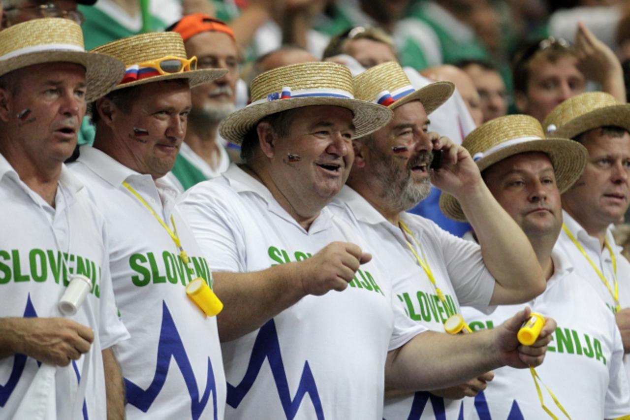 'Supporters of Slovenia team watch their FIBA EuroBasket 2011 Group F basketball game against Finland in Vilnius September 12, 2011. REUTERS/Ints Kalnins (LITHUANIA - Tags: SPORT BASKETBALL)'