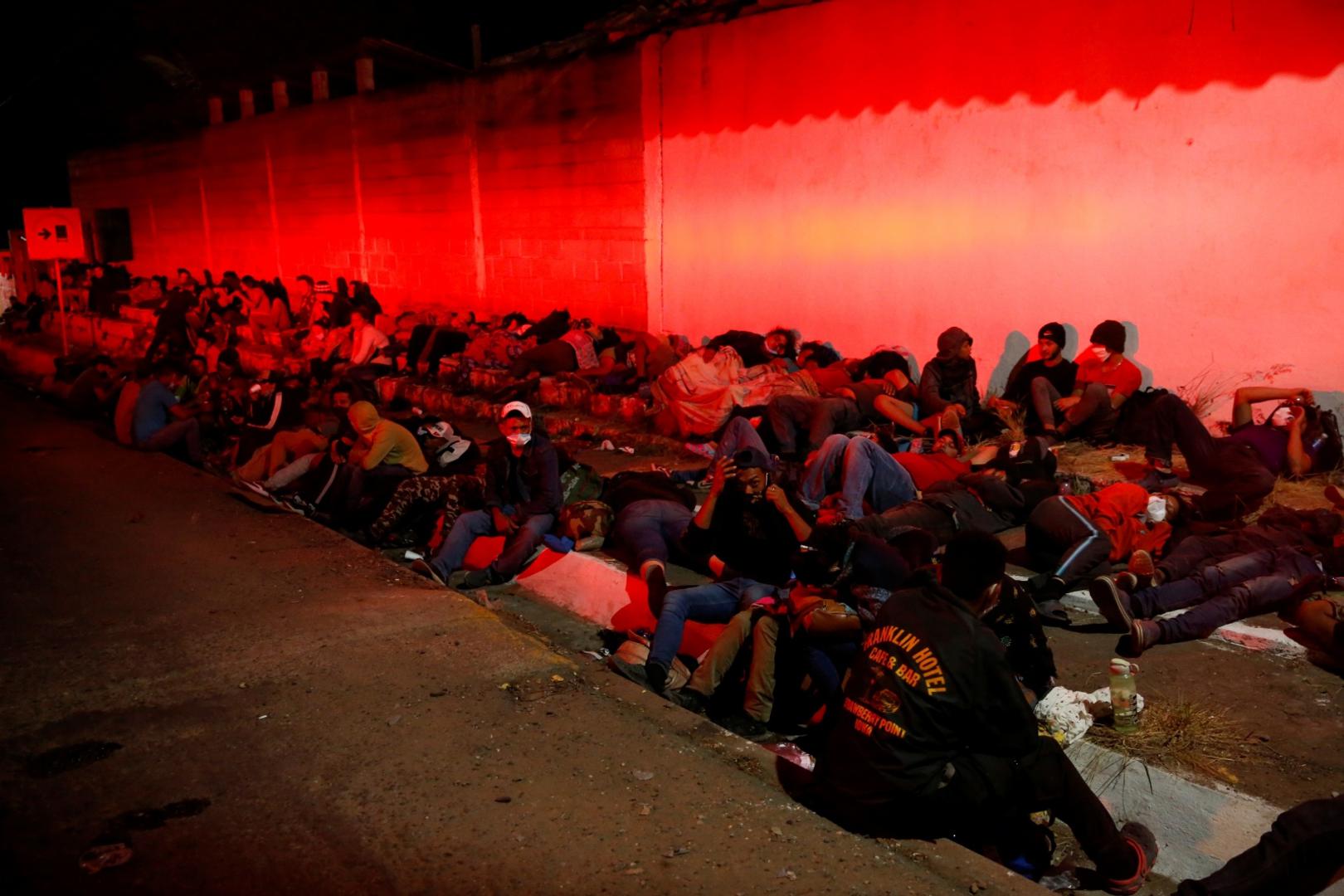 Hondurans take part in a new caravan of migrants set to head to the United States Hondurans taking part in a new caravan of migrants set to head to the United States, take a break in Vado Hondo, Guatemala January 16, 2021. REUTERS/Luis Echeverria LUIS ECHEVERRIA