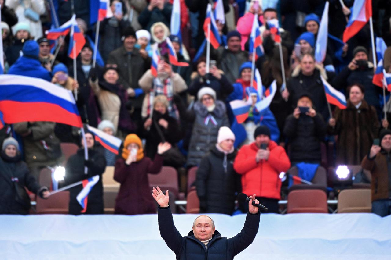 Russian President Vladimir Putin attends a concert marking the eighth anniversary of Russia's annexation of Crimea in Moscow