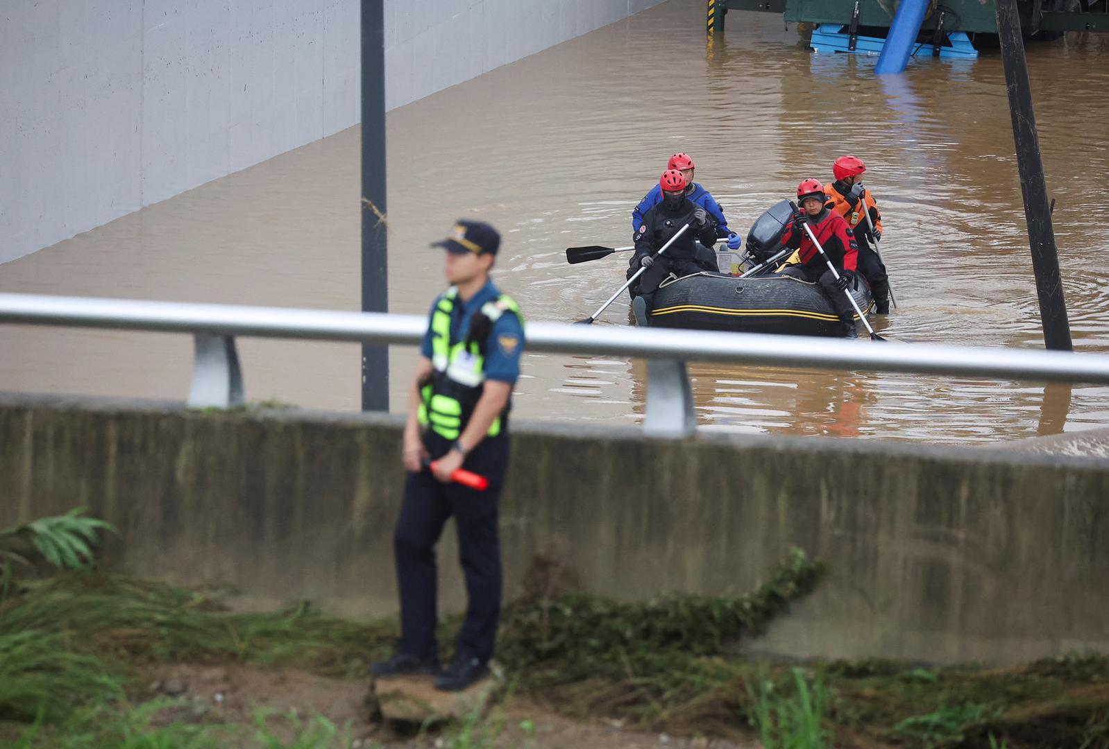 Rescue workers take part in a search and rescue operation near an underpass that has been submerged by a flooded river caused by torrential rain in Cheongju, South Korea, July 16, 2023.   REUTERS/Kim Hong-ji Photo: KIM HONG-JI/REUTERS