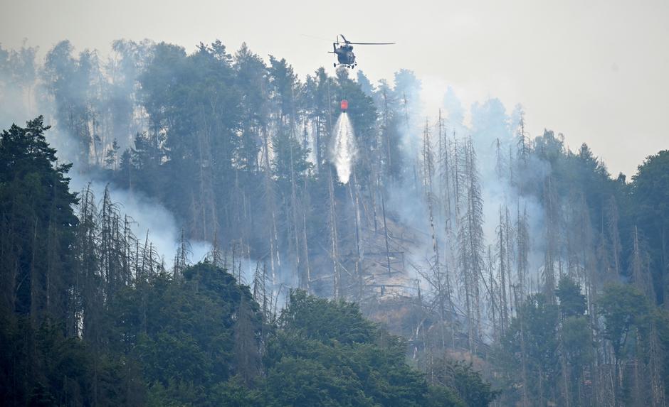 Helicopters help during a forest fire in Schmilka