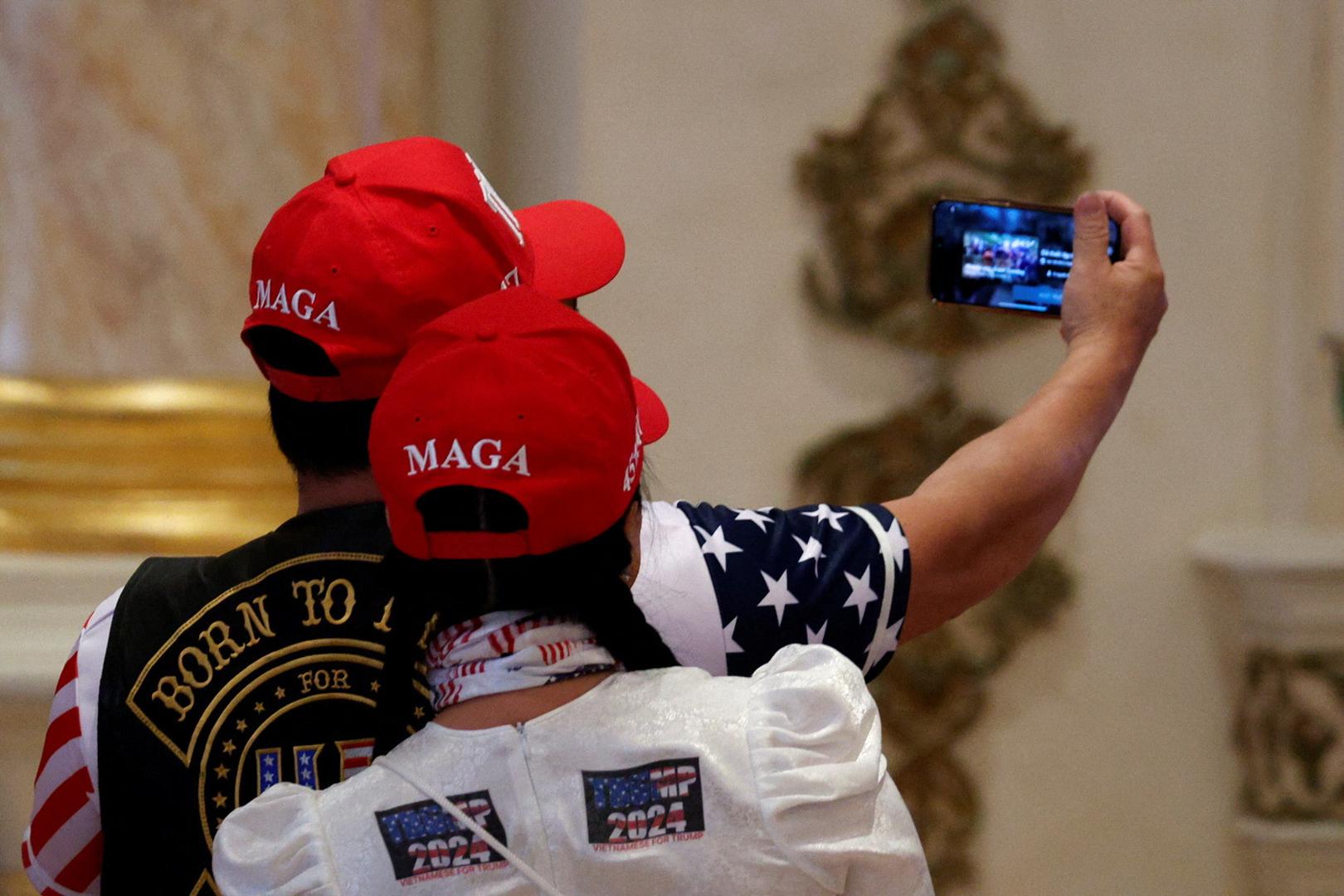 Supporters of Republican presidential candidate and former U.S. President Donald Trump wait for him to arrive to a watch party event to mark the Super Tuesday primary elections at his Mar-a-Lago property, in Palm Beach, Florida, U.S. March 5, 2024. REUTERS/Marco Bello Photo: MARCO BELLO/REUTERS