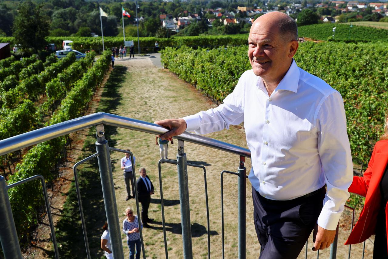 German Chancellor Olaf Scholz visits a vineyard in the town of Werder