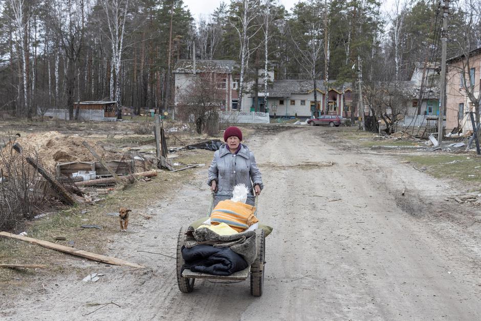 The Wider Image: Ukrainian villagers count dead after weeks confined in school basement