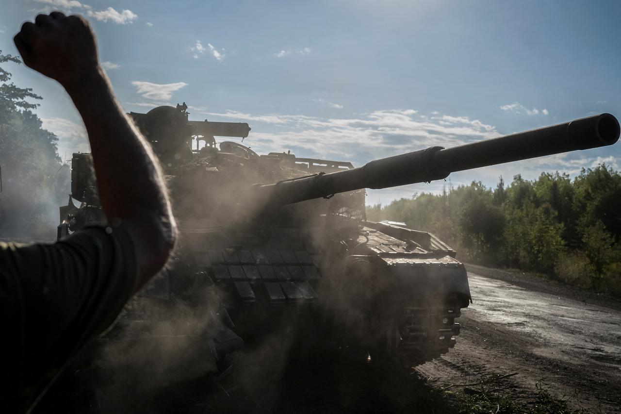 Ukrainian serviceman operates a tank near the Russian border in Sumy region