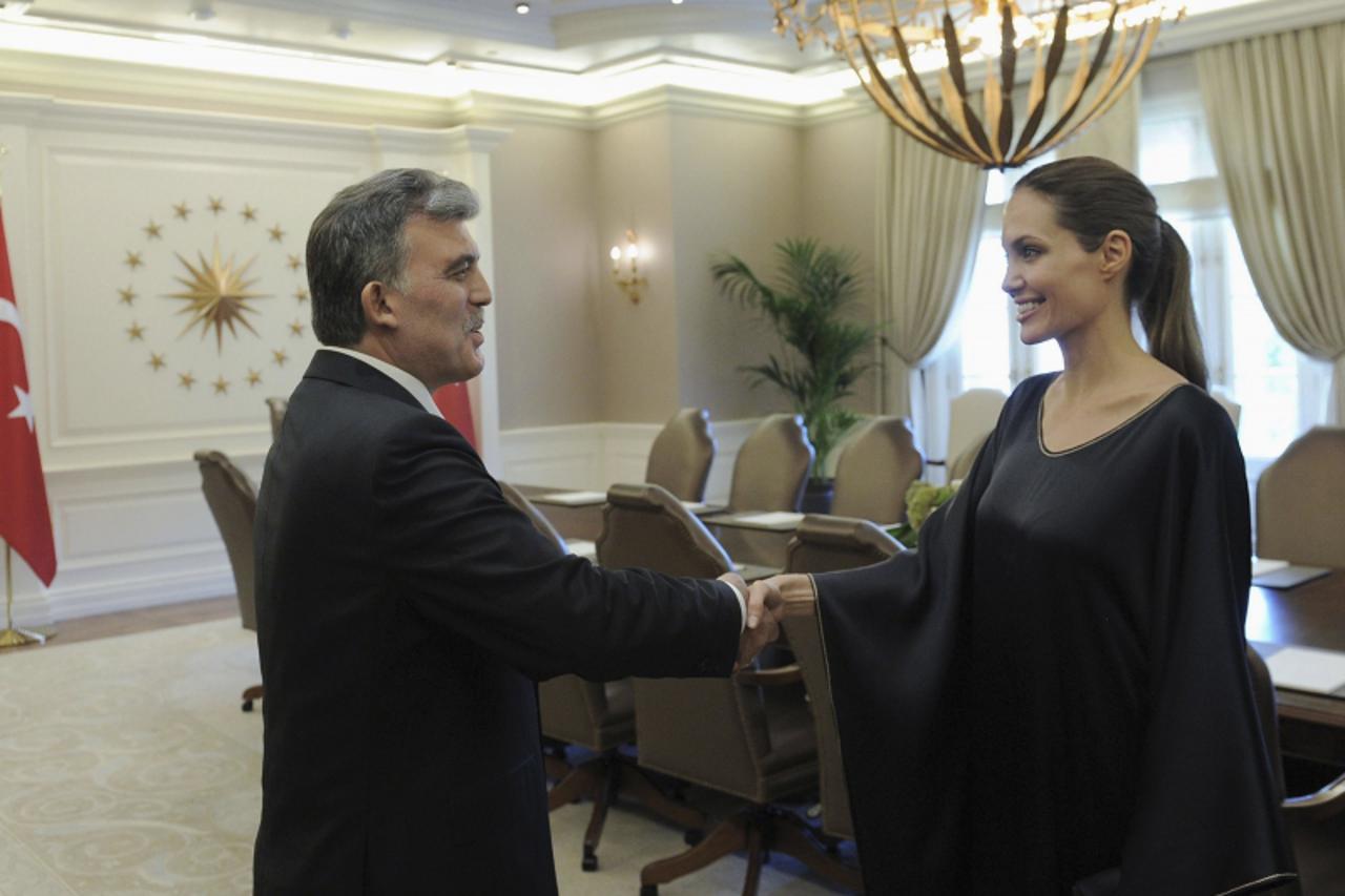 'U.N. refugee agency\'s (UNHCR) special envoy, actress Angelina Jolie meets Turkish President Abdullah Gul in Ankara September 14, 2012. REUTERS/Ayhan Arfat/Presidential Palace Press Office/Handout (T