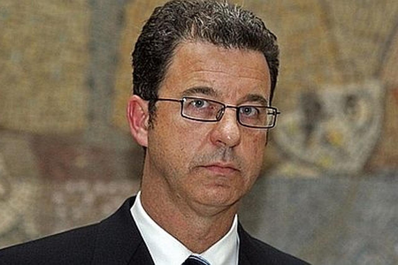 'UN prosecutor Serge Brammertz looks on as he listens to Serbia\'s minister in charge of co-operation with The Hague-based court, Rasim Ljajic (not pictured) during a joint press conference on Septemb