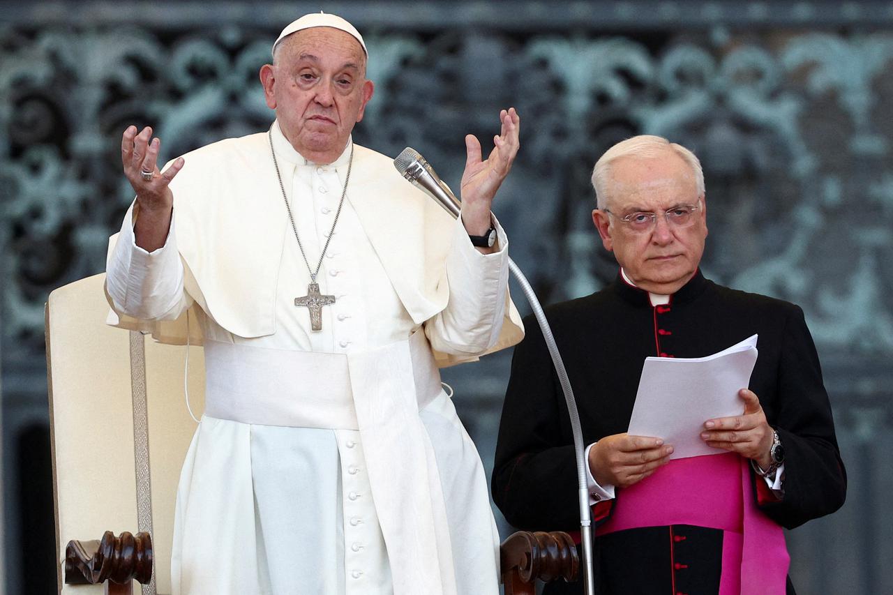 FILE PHOTO: Pope Francis meets altar servers at the Vatican